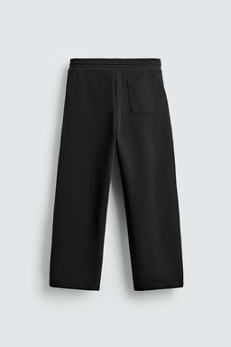NEOPRENE-EFFECT PLEATED BALLOON FIT TROUSERS