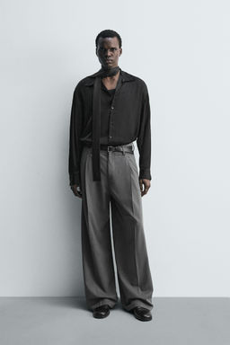 WIDE-LEG PLEATED TROUSERS