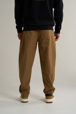 Брюки текстильные Коричневый COMMUTE Woven Track Pants - Anta фото 6