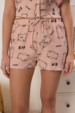 Trendyolmilla Pembe Ay?c?kl? ve Sloganl? Gofre Sortlu Dokuma Pijama Tak?m? THMSS25PT00391
