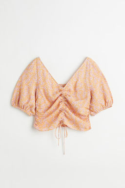 Blusa con escote de pico y cordon de ajuste