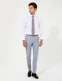 Синие зауженные брюки из ткани