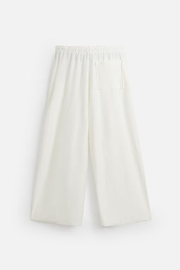 RELAXED FIT TEXTURED TROUSERS - Zara фото 6
