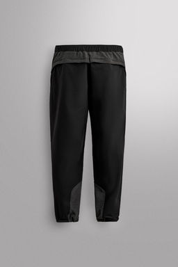TECHNICAL TROUSERS WITH BELT