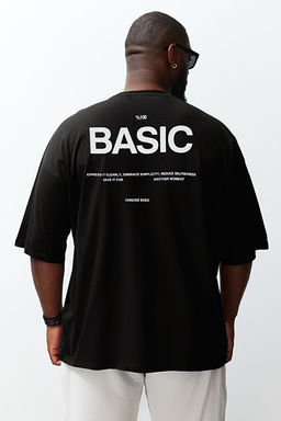 Siyah Oversize/Geni_ Kesim Bisiklet Yaka S_rt Bask_l_ B_y_k Beden T-Shirt TMNSS25BF00004