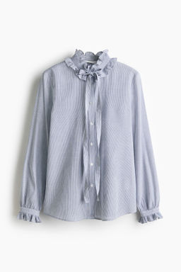 Blusa con ribetes de volante