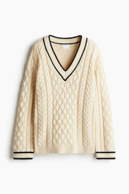Jersey en punto trenzado con cuello de pico