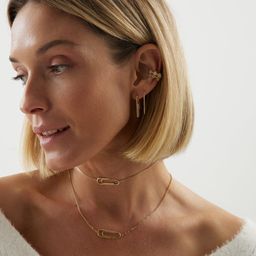 Позолоченные серьги скрепки с фианитами из серебра