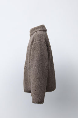 FAUX SHEARLING JACKET WITH EMBROIDERED TEXT