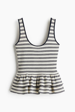 Top de tirantes en punto texturizado con peplum