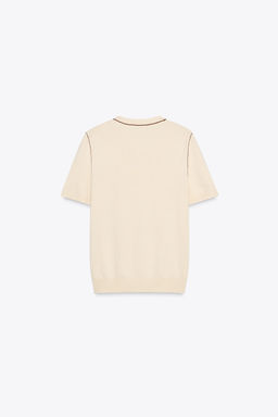 SHORT SLEEVE KNIT TOP WITH PIPING