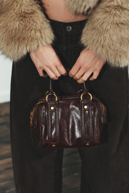 HANDBAG WITH METALLIC DETAILS