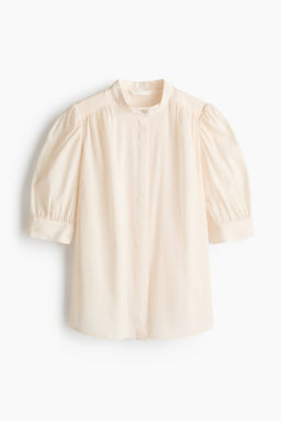 Blusa con mangas abullonadas