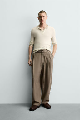 BALLOON FIT TROUSERS WITH PLEATS AND BELT