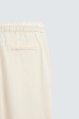 RELAXED FIT TEXTURED TROUSERS - Zara фото 43