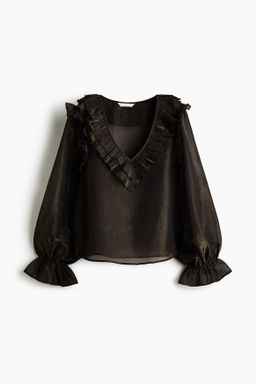 Blusa con ribetes de volante