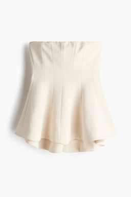 Top bandeau con peplum