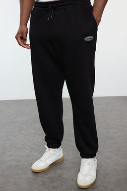 TRENDYOL MAN Buyuk Beden Siyah Oversize/Genis Kesim Cepli Etiketli Esofman Alt? TMNAW25AJ00001