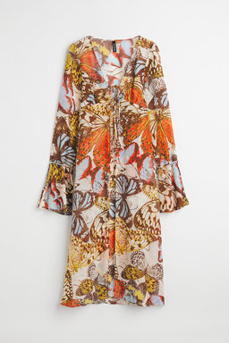 Blusa larga con lazada