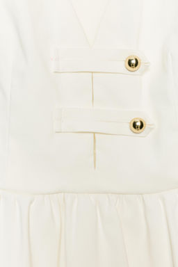 TOP PEPLUM CON BOTONES DORADOS / Blanco roto