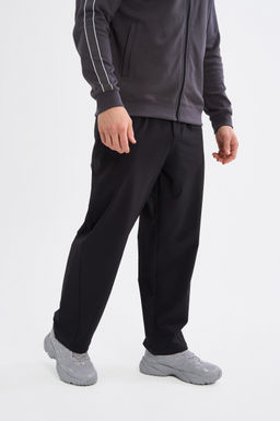 Брюки текстильные Черный ICONIC Woven Track Pants - Anta фото 3