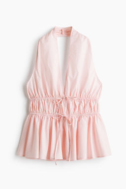 Top halter con peplum
