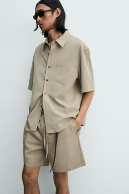BERMUDA RELAXED FIT EFECTO LAVADO / Beige