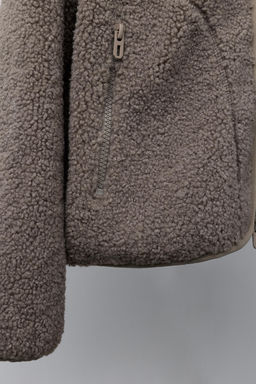 FAUX SHEARLING JACKET WITH EMBROIDERED TEXT