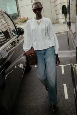 LADDER STITCH PEPLUM BLOUSE