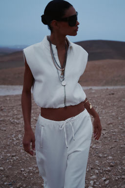 TOPSTITCHED WAISTCOAT WITH ELASTICATED HEM