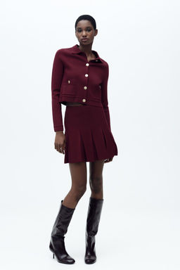 PLEATED MINI KNIT SKIRT