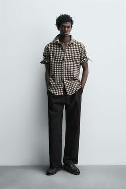 PLEATED RELAXED FIT TROUSERS