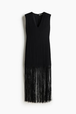 Vestido con hombreras y flecos