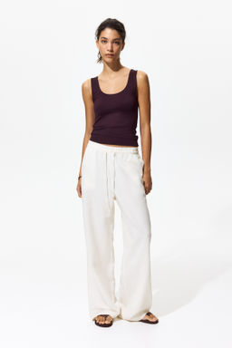 Top sin mangas en microfibra - H&m фото 11