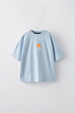 T-SHIRT WITH TAG APPLIQUE