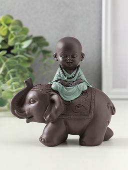 Сувенир полистоун "Маленький будда на слоне" зелёно-коричневый 5,5х12х12 см