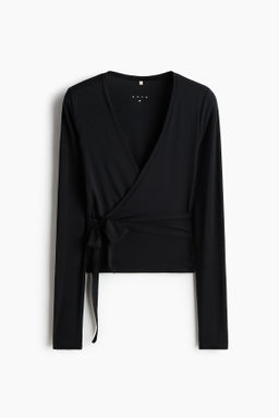 Top de deporte cruzado en modal - H&m фото 10