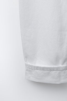 JEANS BARREL BAJO VUELTA / Blanco