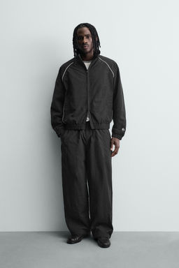 PANTAL?N JOGGER T?CNICO BANDAS CONTRASTE / Negro