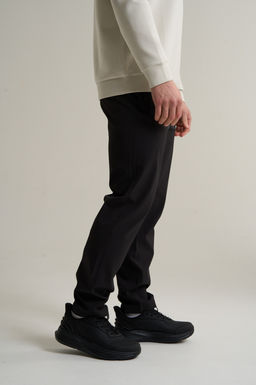 Брюки текстильные Черный TRN Woven Track Pants - Anta фото 4