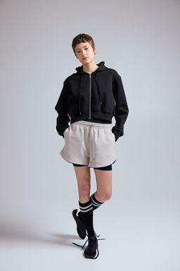 Chaqueta sudadera cropped con capucha y cremallera