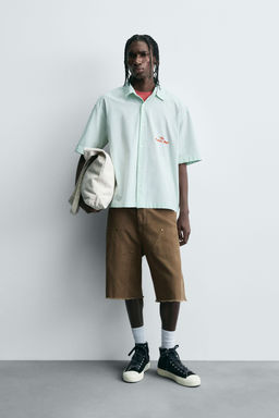 STRIPED SHIRT WITH CONTRAST SLOGAN
