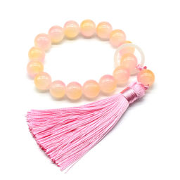 Браслет с кисточкой шарик 12мм цв.персиковый, 16 бусин