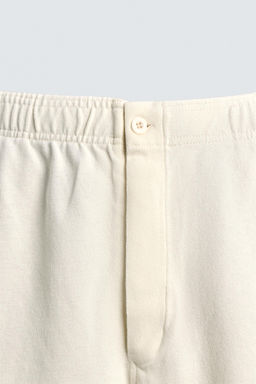 BERMUDA JOGGER REGULAR FIT / Blanco roto