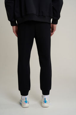 Брюки трикотажные Черный TRN ESSENTIAL Knit Track Pants