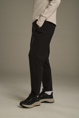 Брюки трикотажные утепленные Черный ANTA RUNNING Knit Track Pants