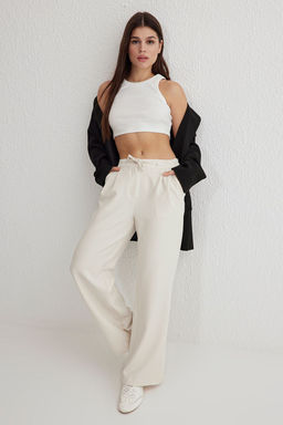 TRENDYOLMILLA Beyaz Bagc?kl? Dusuk Bel Wide Leg/Genis Paca Dokuma Pantolon TWOSS25PL00042