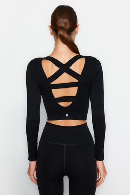 Trendyolmilla Siyah Seamless/Dikissiz S?rt ve Reflektor Bask? Detayl? Crop Orme Spor Ust/Bluz THMAW24BZ00023