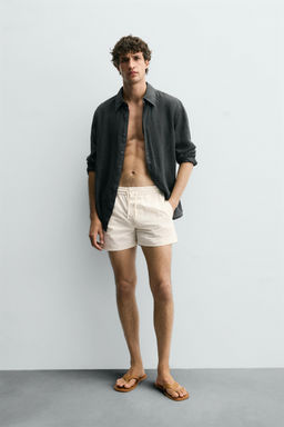 CONTRAST MID-LENGTH SWIMMING TRUNKS