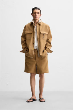 FAUX SUEDE PLEATED BERMUDA SHORTS